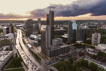 Fototapeta na wymiar Beautiful aerial evening view of Vilnius business district with scenic sunset illumination. City life in Lithuania.