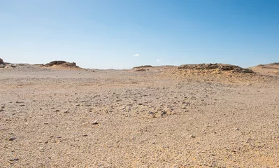 Foto op Aluminium Barren desert landscape in hot climate with rocky scenery © Paul Vinten