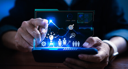 Businessman using computer tablet to analyze business data for strategy, vision, plan and management