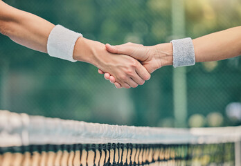 Hand, tennis and handshake for partnership, trust or greeting in sportsmanship over net on the...