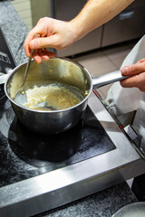 chef cooking food on restaurant kitchen