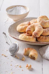 Sweet and fresh croissants with powdered sugar.