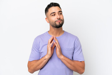 Young Arab handsome man isolated on white background scheming something