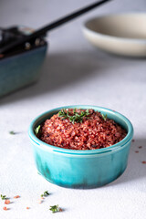 A bowl with homemade red wine infused salt. Condiment to aromatize and season food