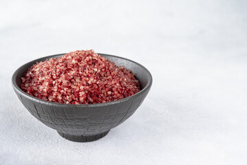 Red wine flavored salt in a bowl. Gourmet condiment to aromatize and season food Dessert, Seafood, Meats, Pasta, Sauce, Finishing Salt
