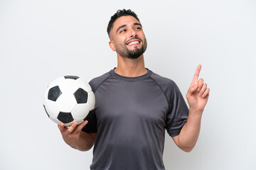 Arab young football player man isolated on white background pointing up a great idea © luismolinero