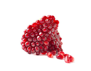Peeled slice of a pomegranate with large grains on a white background close-up.