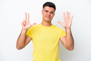 Fototapeta premium Young caucasian handsome man isolated on white background counting eight with fingers