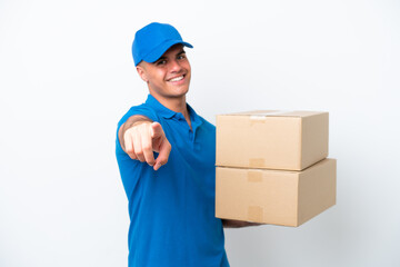 Delivery caucasian man isolated on white background pointing front with happy expression