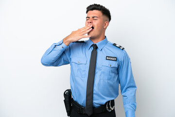Young police caucasian man isolated on white background yawning and covering wide open mouth with hand