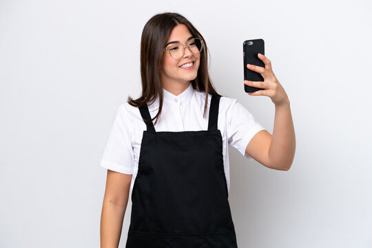 Restaurant Brazilian waiter woman isolated on white background making a selfie