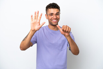 Young caucasian Brazilian man isolated on white background counting six with fingers