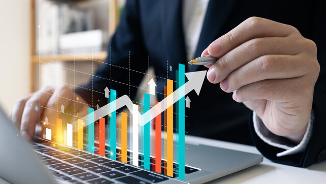 Increase revenue asset and profit with icon concept.Chart growth rate and growing arrow, businessman analyzing investment diagram, stock market research, finance business.