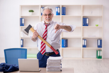 Old male employee unhappy with excessive work in the office