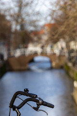 Delf, Netherlands Bicycle handlebars and a canal