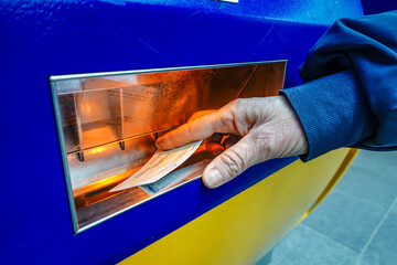 The Hague, Netherlands A woman buys a train ticket from an automated machine at the central train station.