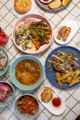 Dishes with different food on the table in the cafe. top view