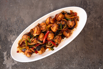 fried dumplings with spices on a white plate top view