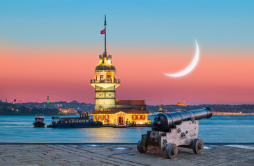 Fototapeta premium Ramadan Concept - Istanbul Maiden Tower with cannon at sunset (kiz kulesi)