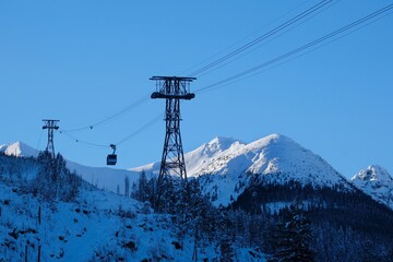 Ropeway to Kasprowy Wierch Peak in Tatras Mountains in beautiful winter scenery in morning light, famous place in Tatras, Poland. Tatra National Park