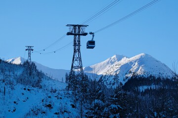 Ropeway to Kasprowy Wierch Peak in Tatras Mountains in beautiful winter scenery in morning light, famous place in Tatras, Poland. Tatra National Park