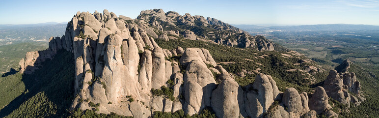 Fototapeta premium Panoramic shot of Montserrat under the blue sky in Catalonia, Spain