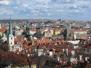 A panoramic view of Prague's cityscape from Prague Castle on a sunny day with interesting clouds.  Image has copy space.