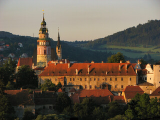 Cesky Krumlov's famous medieval castle in the late afternoon light.  The castle was first built in 1240.  Image has copy space.