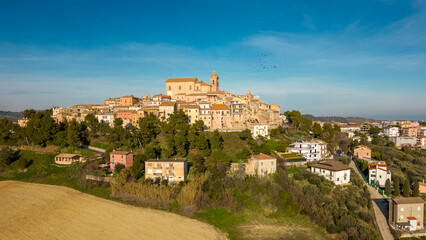 Fototapeta na wymiar Italy, February 2023: aerial view from the drone of the medieval village of Monteprandono in the province of Ascoli Piceno in the Marche region