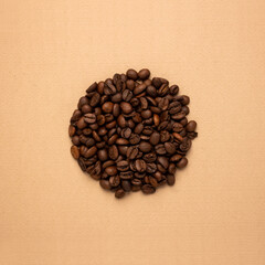 Obraz na płótnie Canvas Coffee beans in the shape of a circle on a brown background, Coffee concept, Flat lay