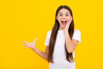 Excited teenager, glad amazed and overjoyed emotions. Amazed child with open mouth on yellow background, surprise.