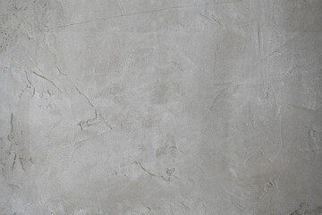 Rough concrete wall. Gray background with textured surface. Grunge. Decorative plaster.