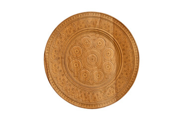 Round wooden decor element with openwork carvings. Wooden dish with ornaments. Isolate on white background.