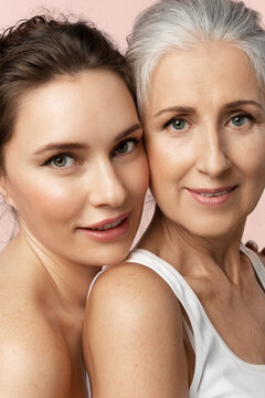 Two  beautiful women. Close-up portrait about caring for different facial skin types and good intergenerational relationships.