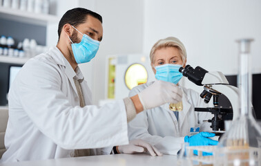 Research, glass beaker and scientists working in laboratory for medical cure or vaccine. Innovation, teamwork and team of professional scientific experts with face mask in pharmaceutical science lab.