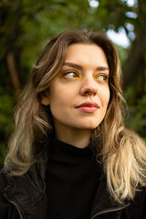 Fototapeta premium Close up photo of attractive young woman. She has perfect skin and colorful make up. Portrait.