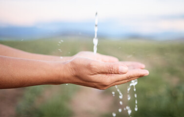 Hands, water and washing or cleaning for hygiene, hydration and sustainability with a splash...
