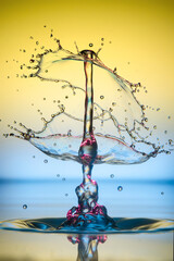 Water drop falling and colliding with another one	