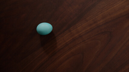 spinning easter egg on walnut table