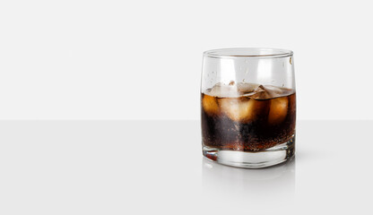 Cola with ice. Cocktail in a glass. Copy space for text.