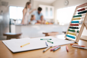 Crayon, book and paper with education toys on table for child development, learning and knowledge. Family home, children and notebook for drawing, writing and color activity for kids in living room