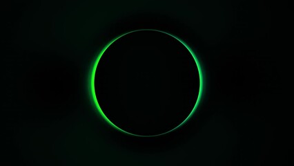 Spinning round glow green shape in dark black backdrop. Loop Footage in 4K with abstract colorful radial form and copy space. Transition to Blackout and Loop included.