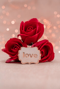 Red rose with love tag image happy valentines day, wedding engagement and birthday gift concept photo