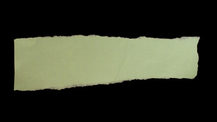 Torn paper piece isolated on black background