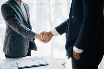 Business partnership handshake concept.Photo two coworkers handshaking process.Successful deal after great meeting...