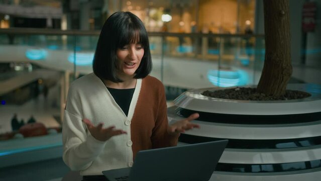 Caucasian emotional woman lady girl talking with laptop gesticulate talk to webcam discuss with computer video call conference. Angry businesswoman explain with virtual chat distant business meeting