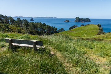 Bench with Coromandel Peninsula island view New Zealand 
