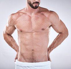 Fitness, abs or body of a man cleaning for wellness, luxury skincare or self love on studio...