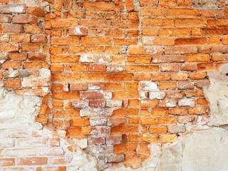 Damaged red brick wall texture background.