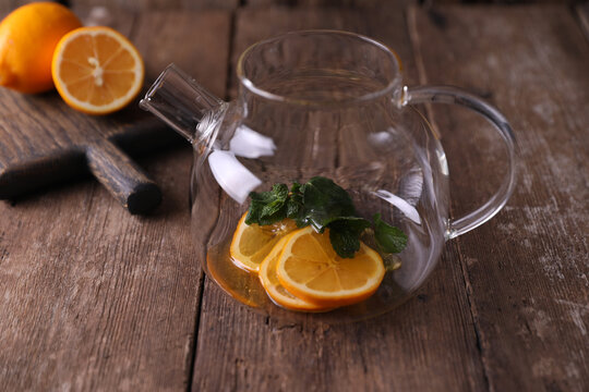 Sbiten, a drink with lemon, mint and honey in a glass teapot